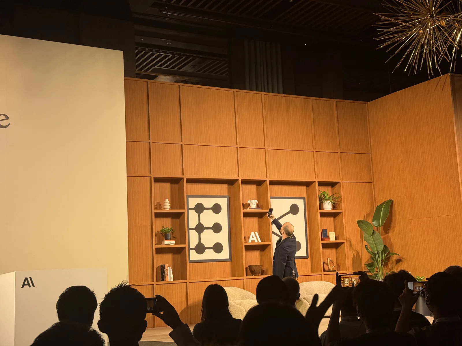 Boris on stage taking a selfie of the room